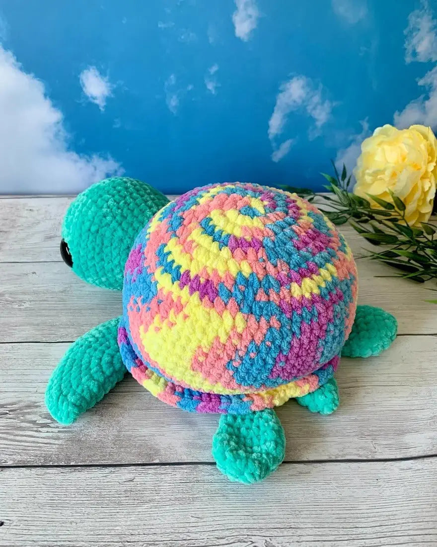 Peluche tortue géante Les mailles calines